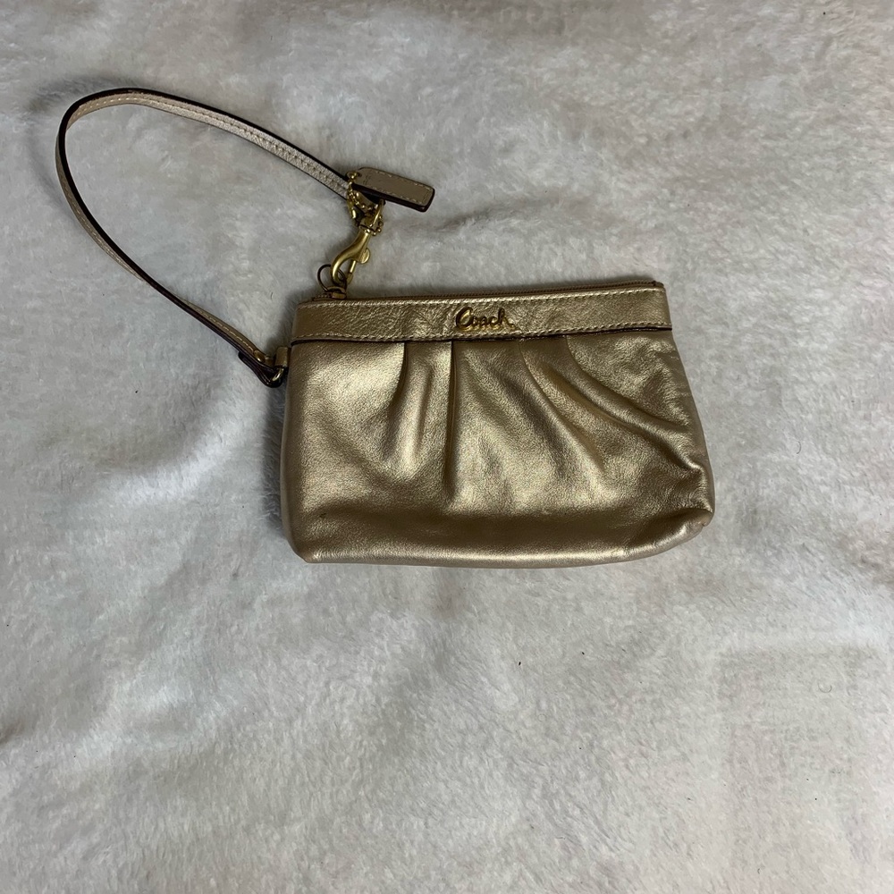 Coach gold wristlet.